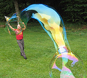 Casey demonstrating the skill of creating massively large soap bubbles
using his professional, customized formulas